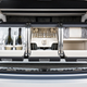 Illustration for article titled The Bentley Bentayga Has A Trunk Full Of Champagne And Diamonds In Its Clock